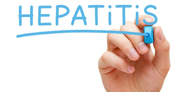 Hand writing Hepatitis with blue marker on transparent wipe board.
