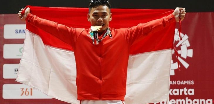 Eko Yuli mempersembahkan medali emas pertama Indonesia di cabang angkat besi Asian Games. Foto:detiksport