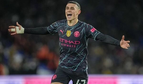 Phil Foden merayakan gol. Kin Cheung/AP Photo